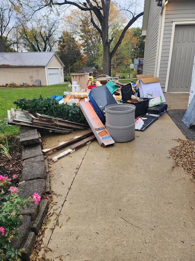 Dumpster being loaded with debris for Commercial Dumpster Rental in West Chicago